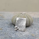 Rectangular textured silver pendant