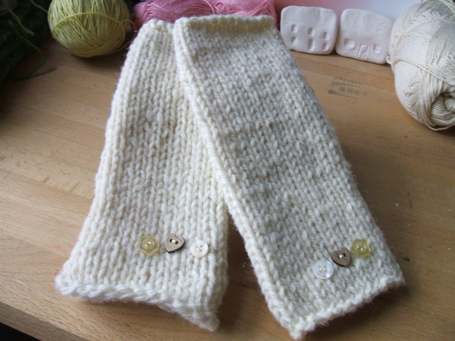 Hand knitted cream wool wrist warmers or fingerless gloves
