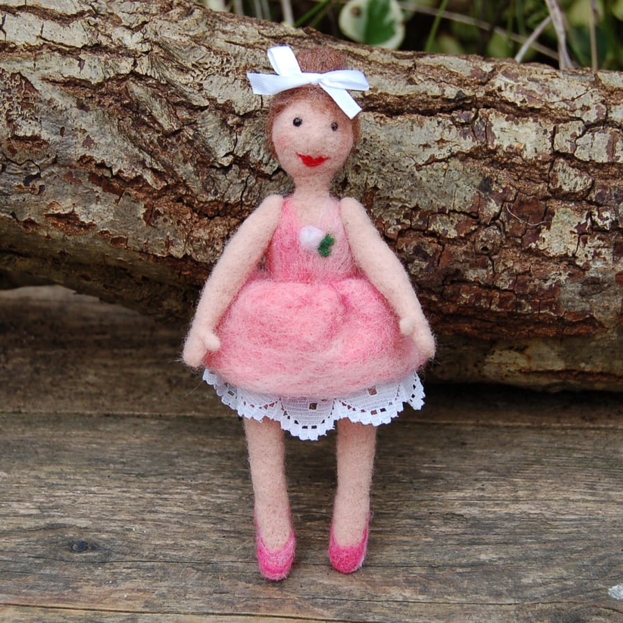 Maisie the ballerina sat on a hoop.  Needle felt sculpture.