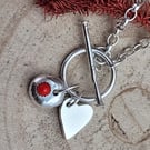 BANGLE WITH PEBBLE AND HEART CHARM