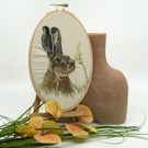 Embroidered hoop picture of a hare