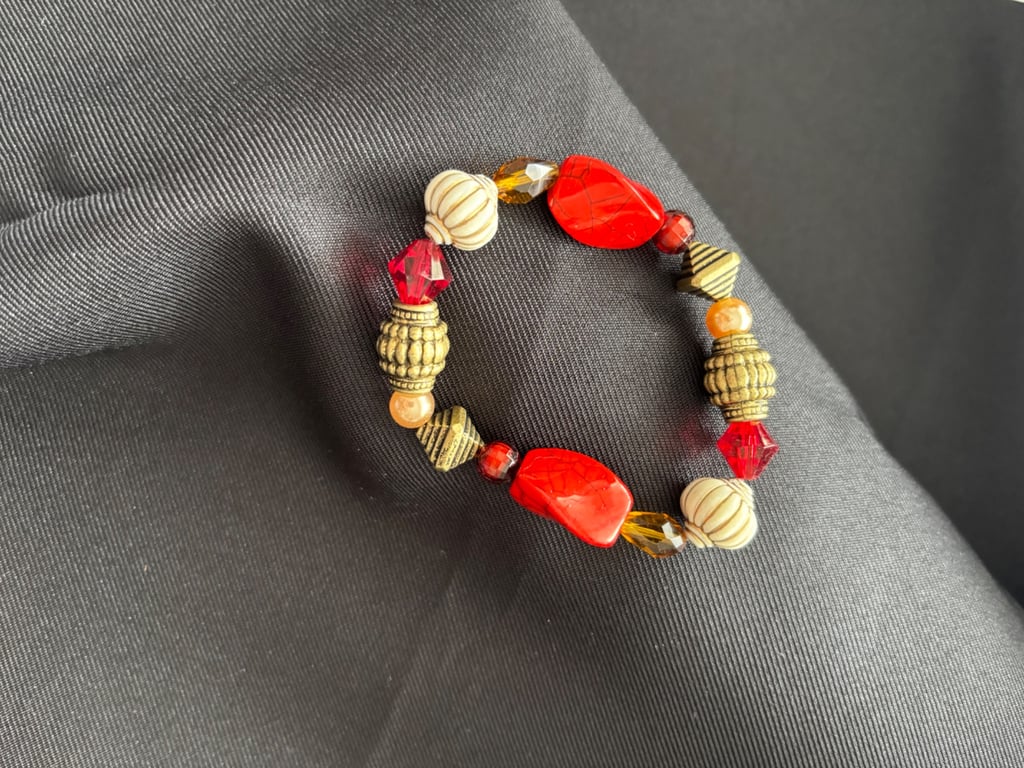 Handmade bracelet. 16cm. Beautiful red, gold & yellow colours. 