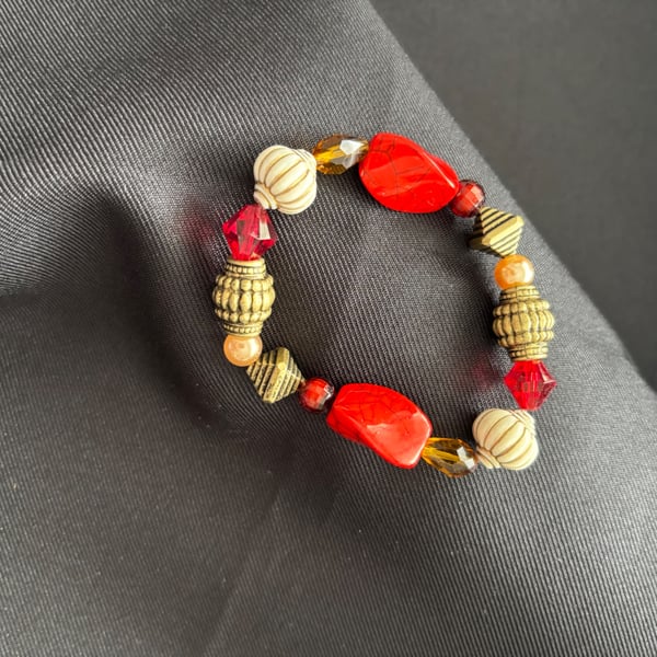 Handmade bracelet. 16cm. Beautiful red, gold & yellow colours. 