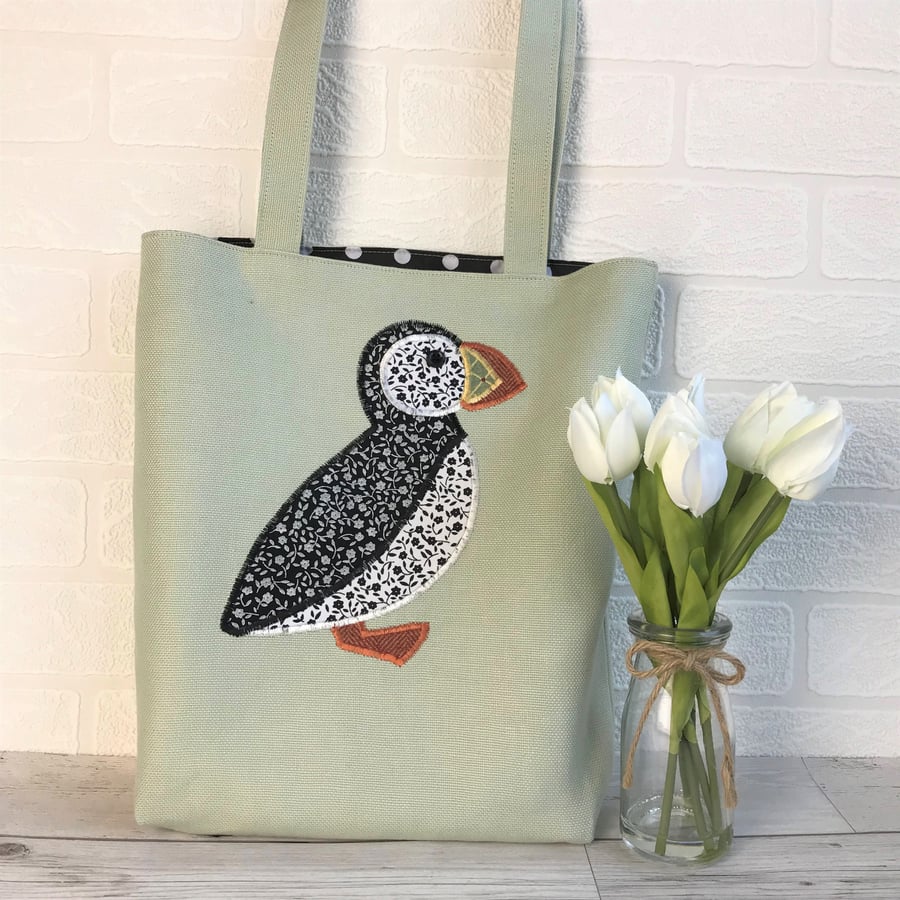 Puffin tote bag in pale green with black and white ditsy floral pattern Puffin