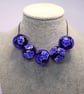 Handmade blue floral patterned lamp work glass beads - Image 10
