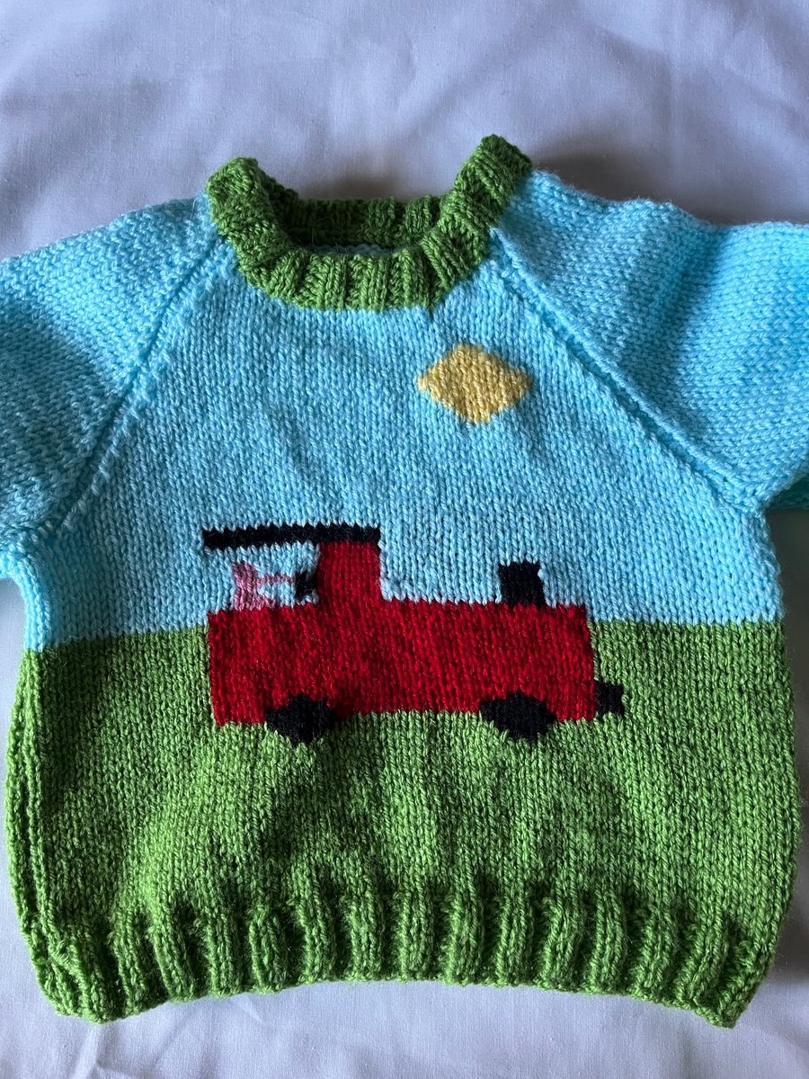Fun hand knitted toddlers train jumper