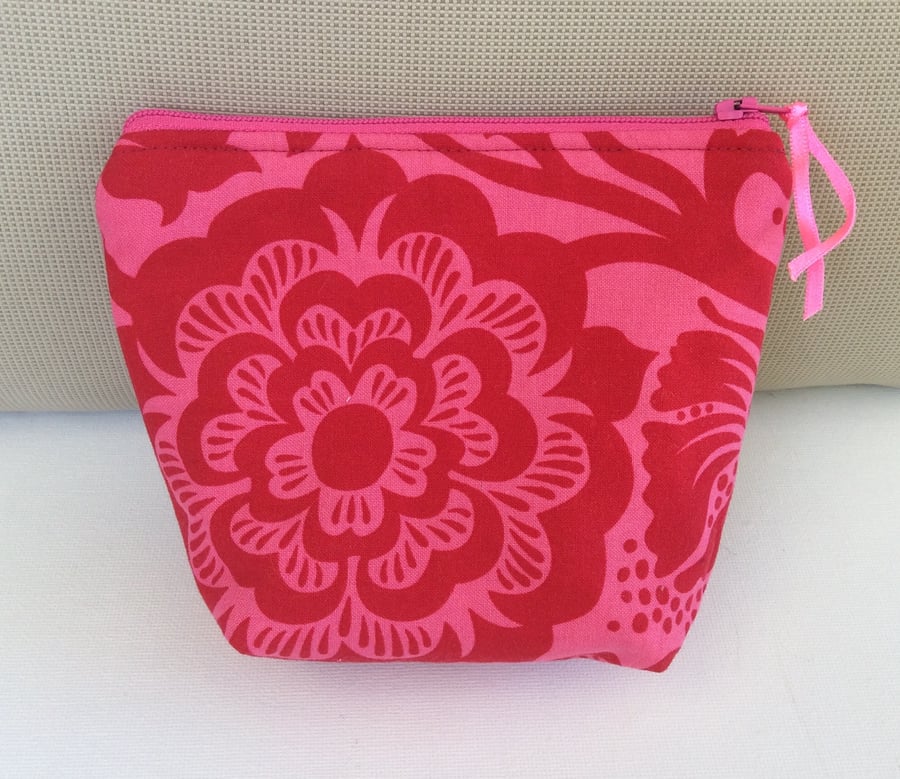 Floral Make Up Bag, Red blossoms and leaves on a pink background