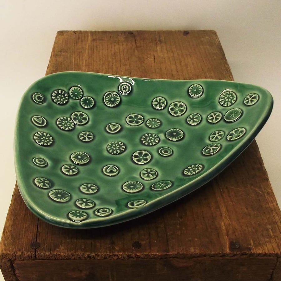 Green Pottery Dish with detailed pattern. ceramic.