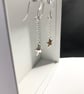 Silver Star Drop Earrings - Image 1