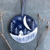 Ceramic Winter scene hanging decoration.