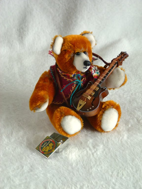 Django, a 5" collectable bear from antique velvet, plays guitar.