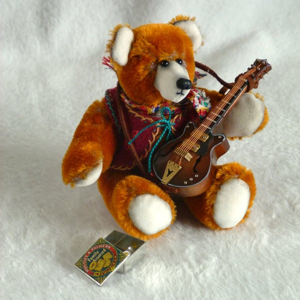 Django, a 5" collectable bear from antique velvet, plays guitar.