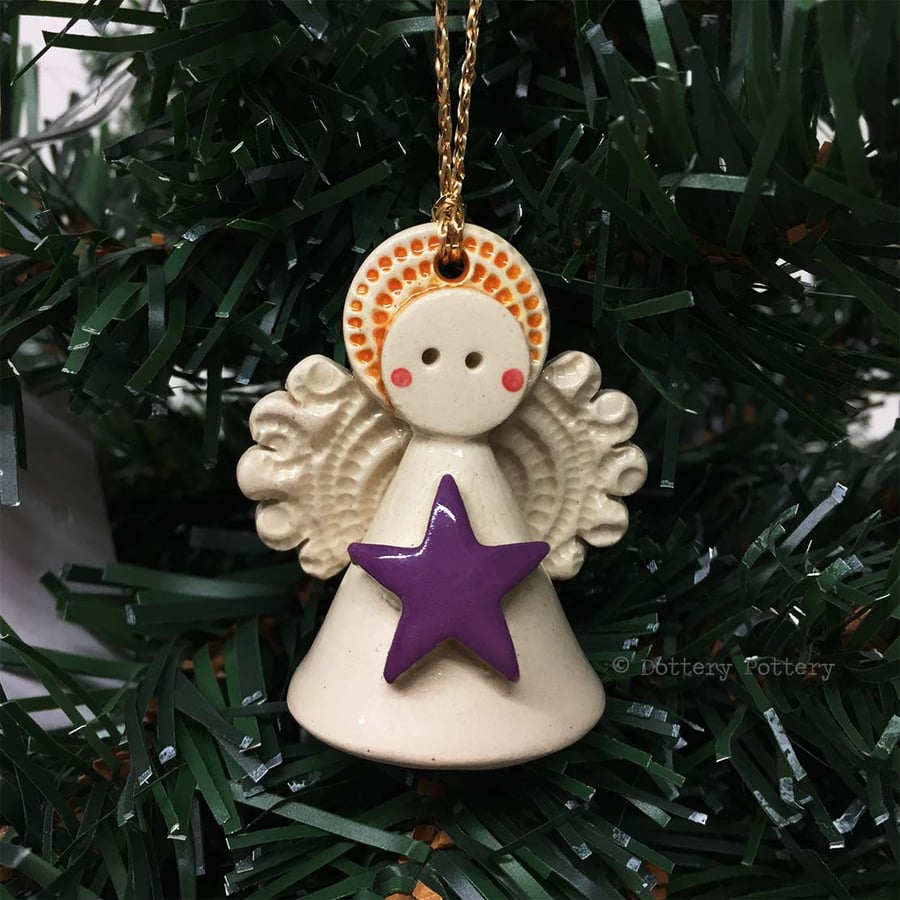 Teeny little ceramic angel Christmas decoration purple star design pottery angel