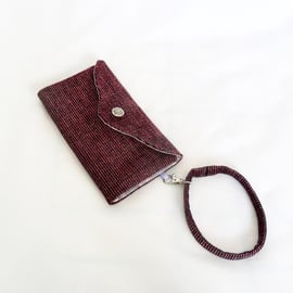 Pink and purple clutch wallet. 