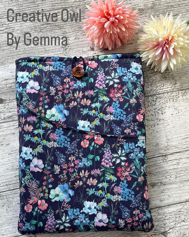 Fabric book sleeve with pocket for paperback books. Padded and fully lined.