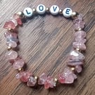 "Love" - rose pink crystal chip stretchy fashion bracelet with L-O-V-E beads