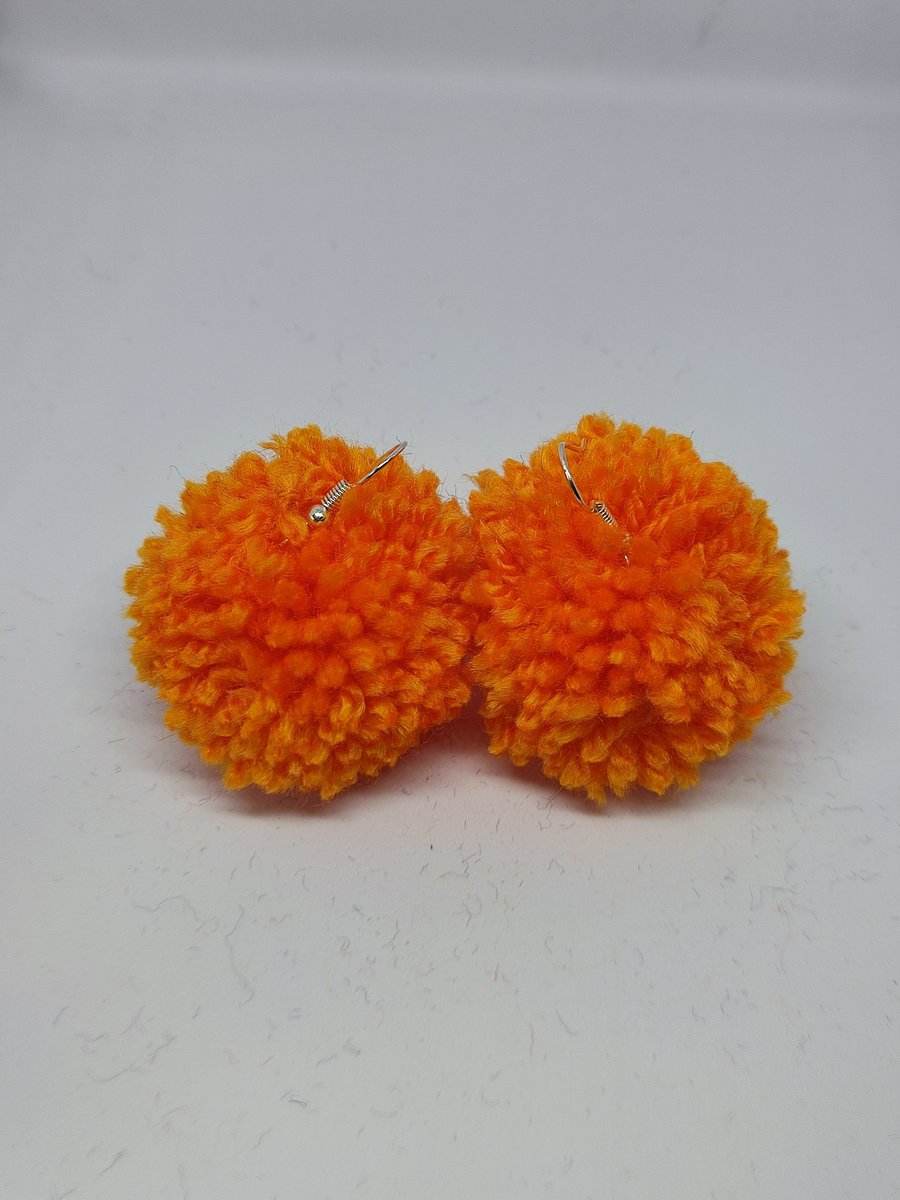Orange pom pom earrings 
