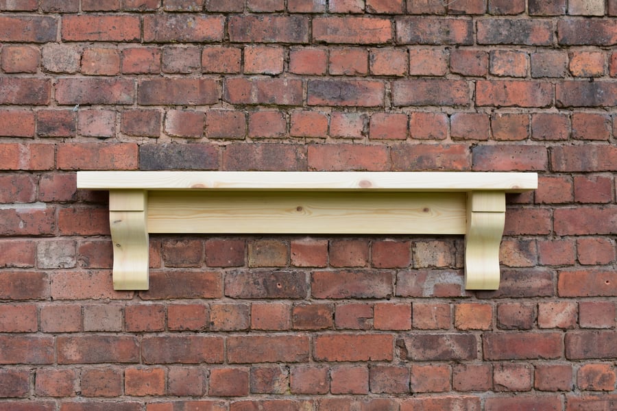 Chunky solid pine mantle shelf with corbels and a 45mm top. 