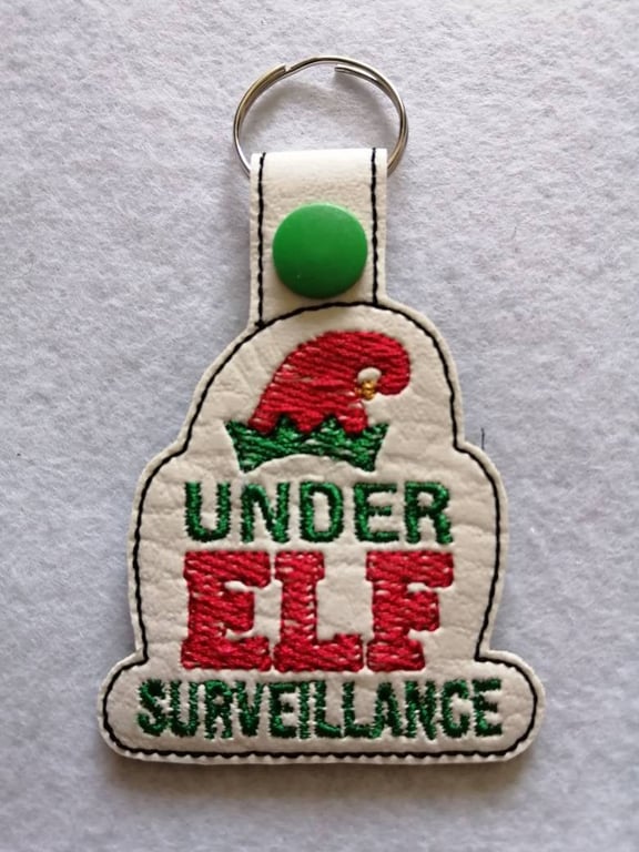 732. Under Elf surveillance keyring.
