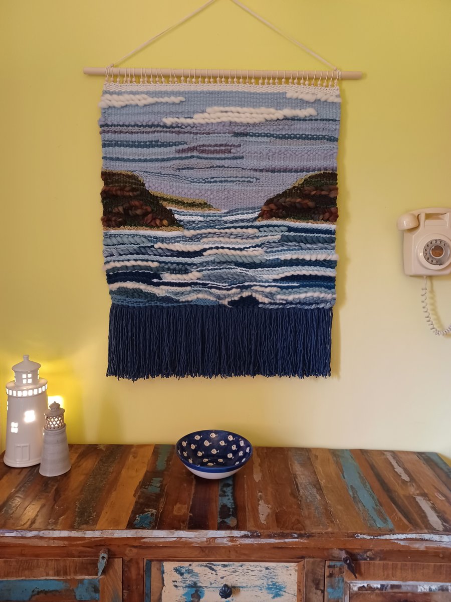 Hand woven wall hanging of bay and headland