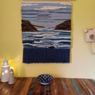Hand woven wall hanging of bay and headland