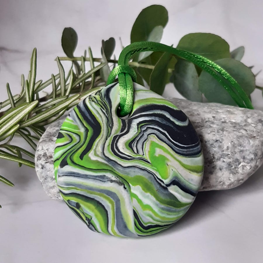 Green, black and silver polymer clay pendant