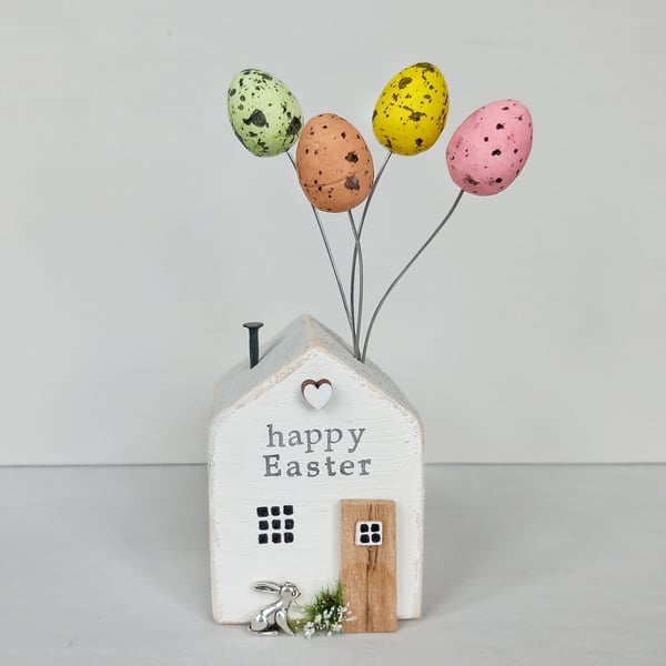 'Happy Easter' Cottage - wooden house with Easter egg balloons 