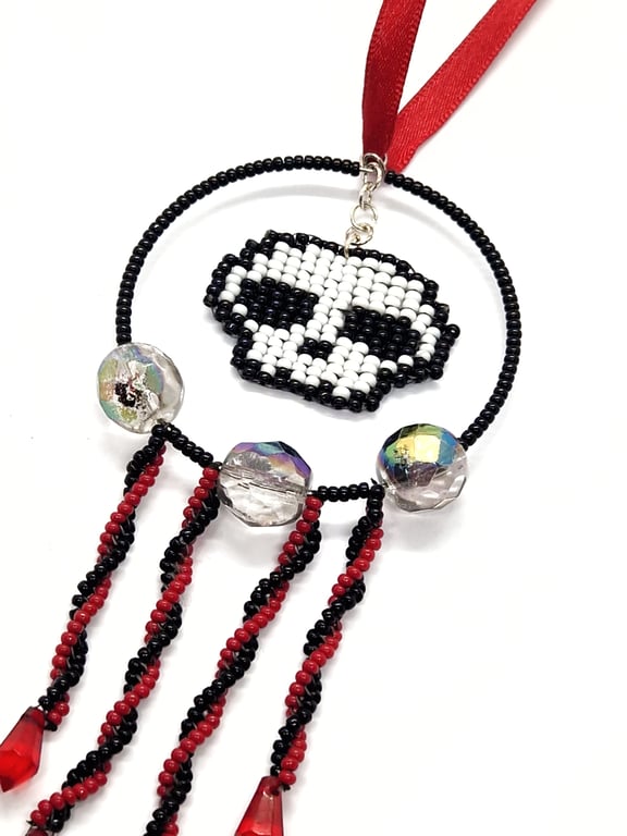 Red white and black beaded skull hanging decoration