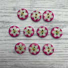 10 round buttons in pink with flower design