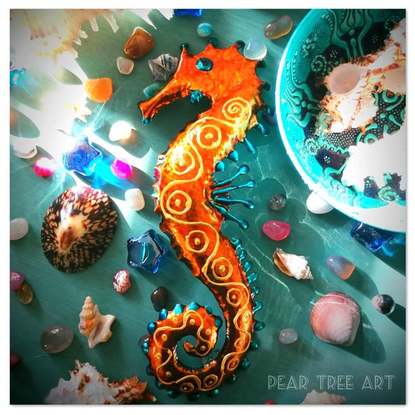 Orange and Turquoise metal Seahorse wall decoration. Made from a coffee tin.