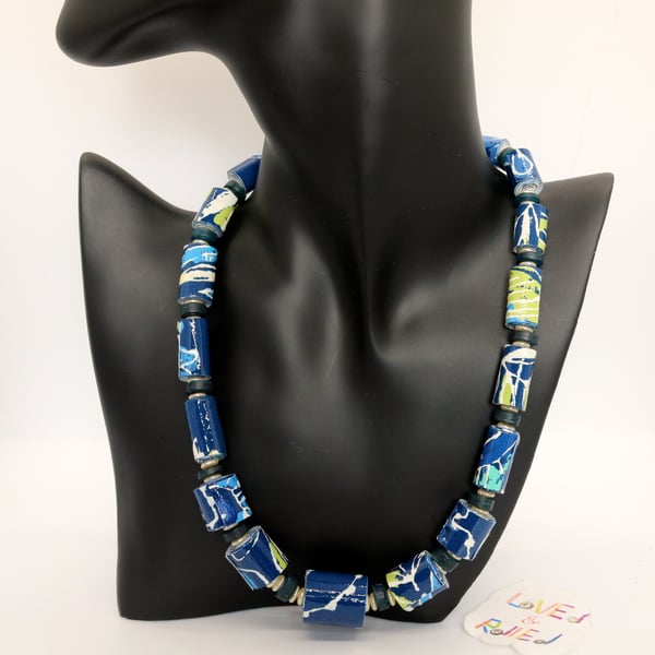 Blue and green necklace made of textured patterned wall paper beads