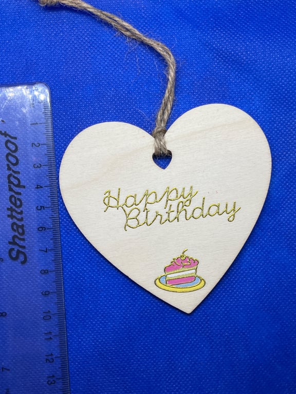 Wooden heart with 'happy birthday' sentiment.