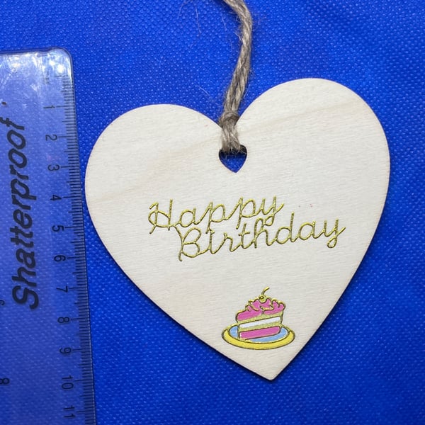 Wooden heart with 'happy birthday' sentiment.