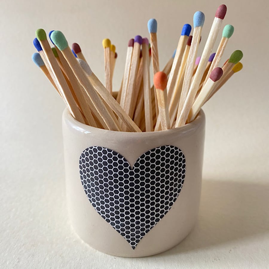 Heart striker ceramic match pot.