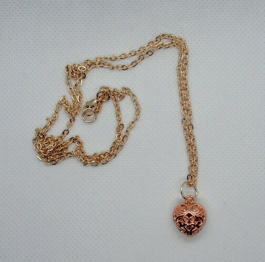 Long rose gold plated necklace with filigree heart charm