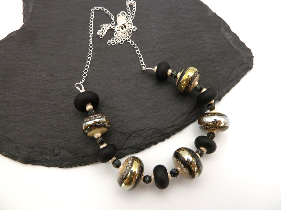 lampwork glass beaded necklace, black and ivory, sterling silver chain