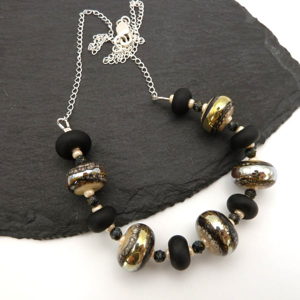 lampwork glass beaded necklace, black and ivory, sterling silver chain