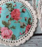 Set of four handmade floral coasters with crochet edge. - Image 3