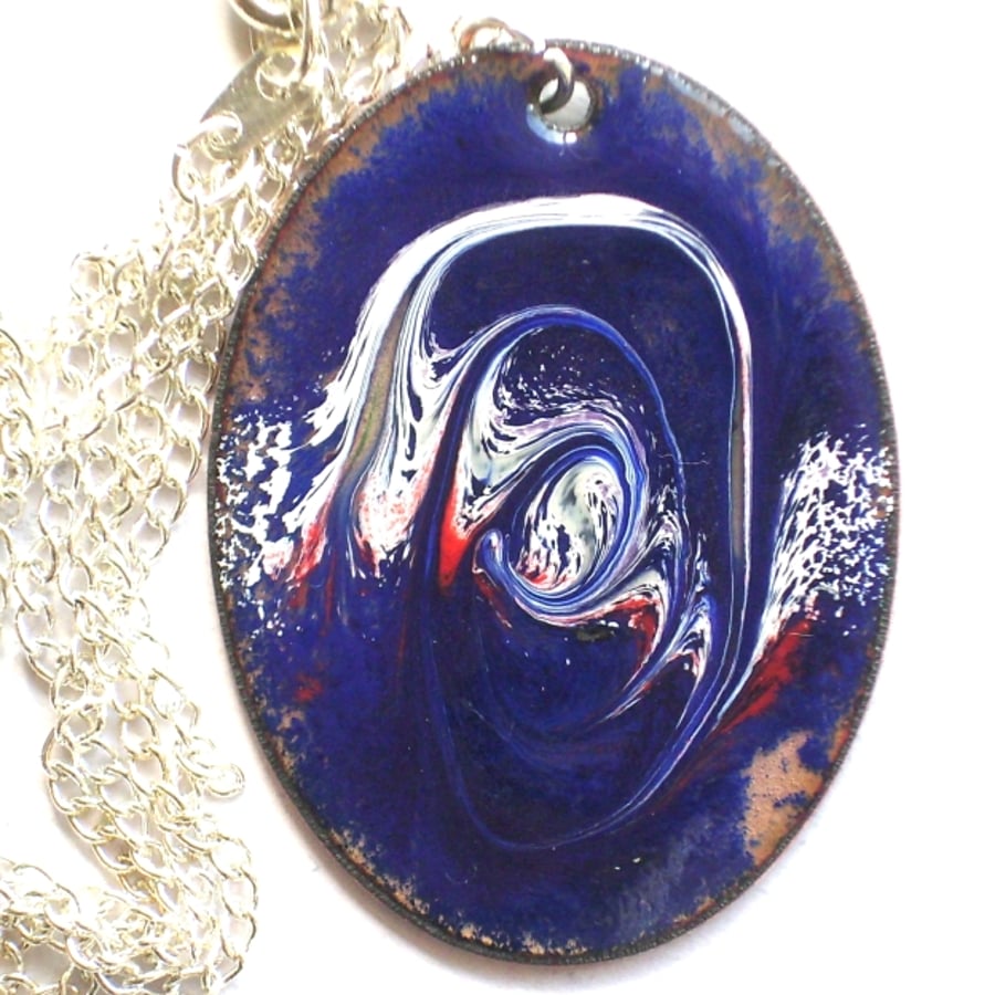 oval pendant - white and red scrolled on blue