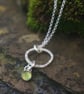 Textured Circle Silver Pendant with Peridot Drop - Image 1