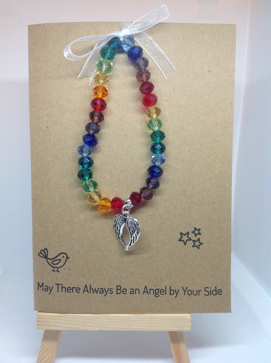 stretch bracelet, rainbow glass beads with angel wings charms on greetings card