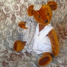 Collector's teddy bear 'born again' from antique and vintage materials. Matilda