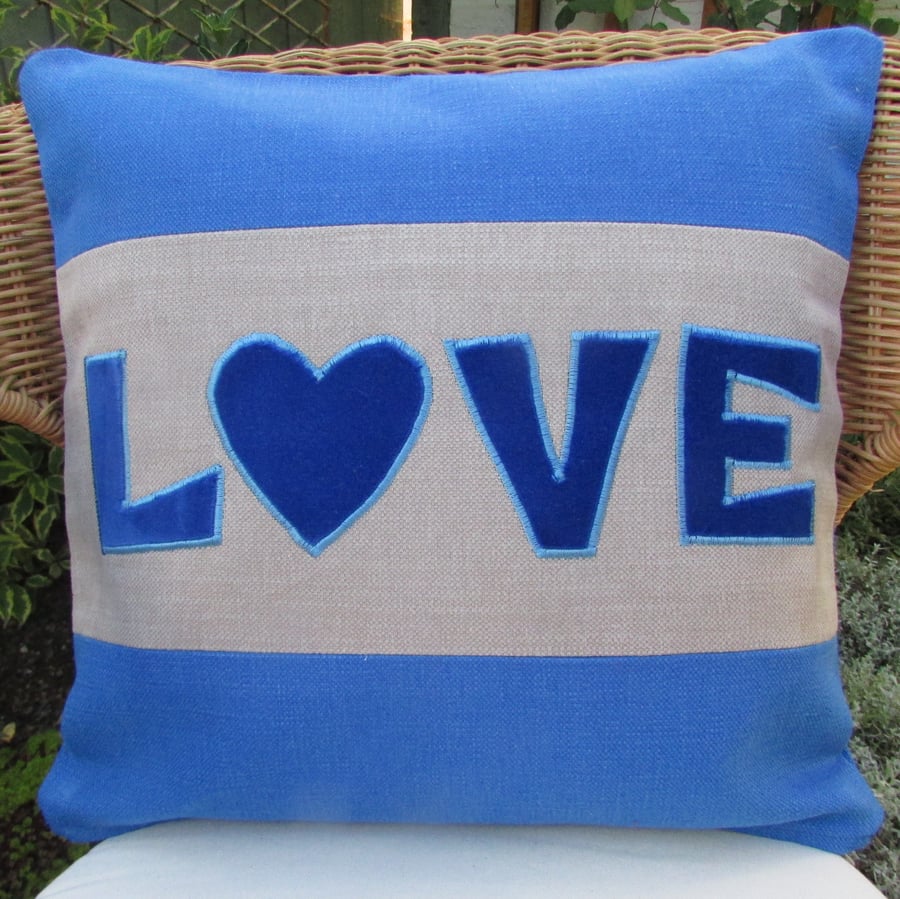 SALE - Bright blue "Love" appliqued cushion