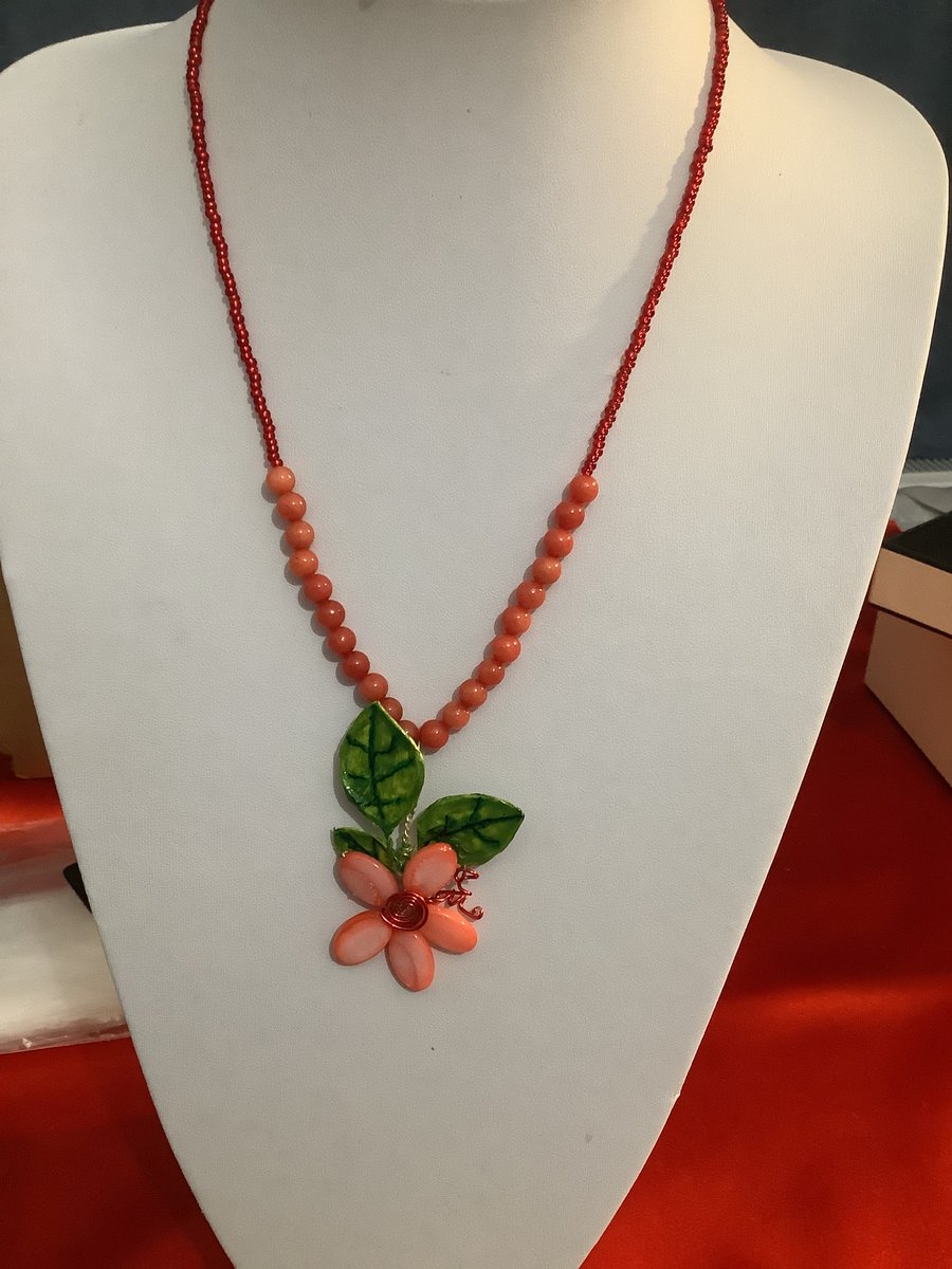 Bead and seed bead necklace with flower accent 