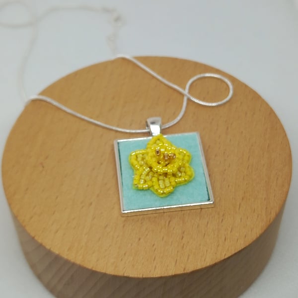 Daffodil bead embroidered pendant