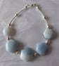 Blue Sky Sterling Silver Bracelet featuring Hexagonal blue Opals