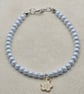 Pearl blue seed bead bracelet with small white flower charm