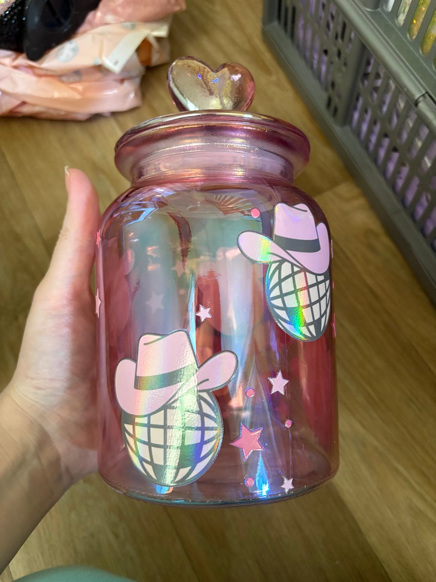 Pink jar with holographic disco balls with cowboy hats 