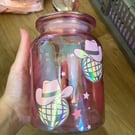 Pink jar with holographic disco balls with cowboy hats 