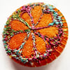 One Inch Badge Orange Flower 